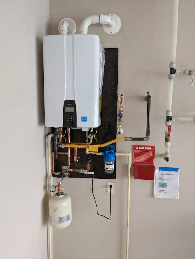 Professional plumber installing copper piping in a Seaford home
